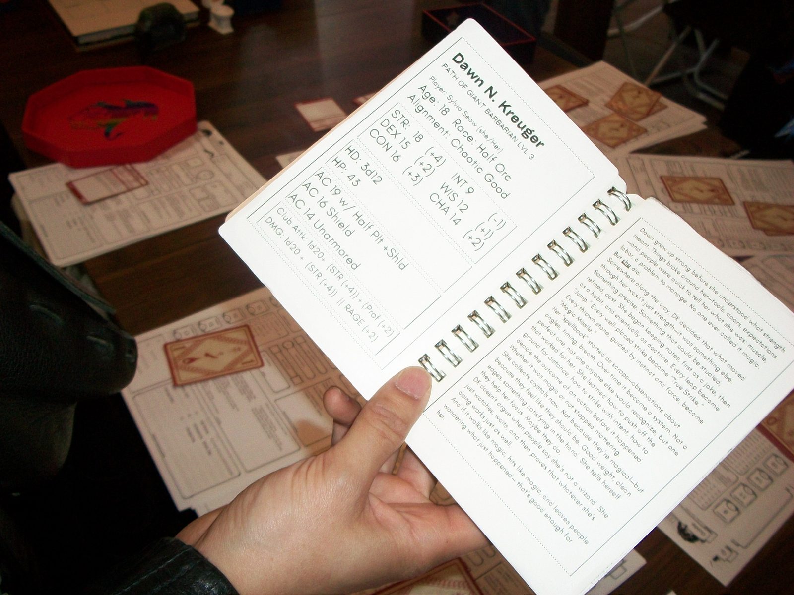 A hand-bound RPG character booklet