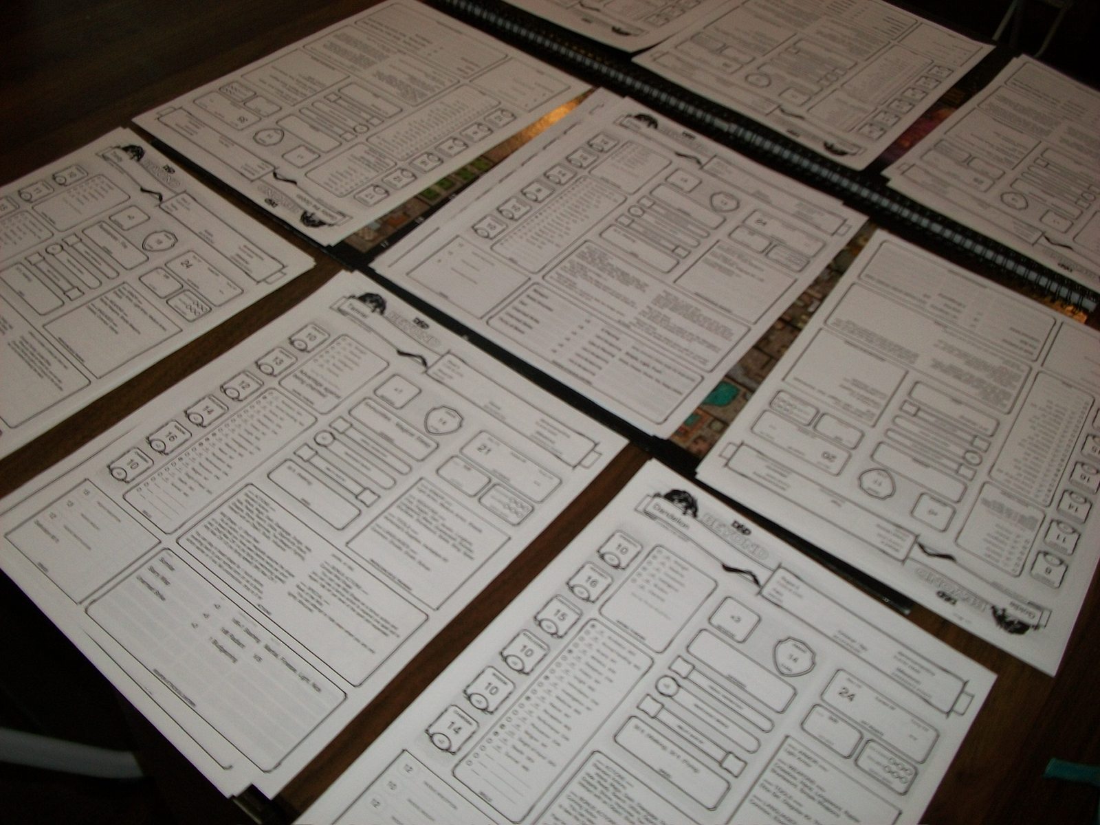 D&D character sheets spread across the table