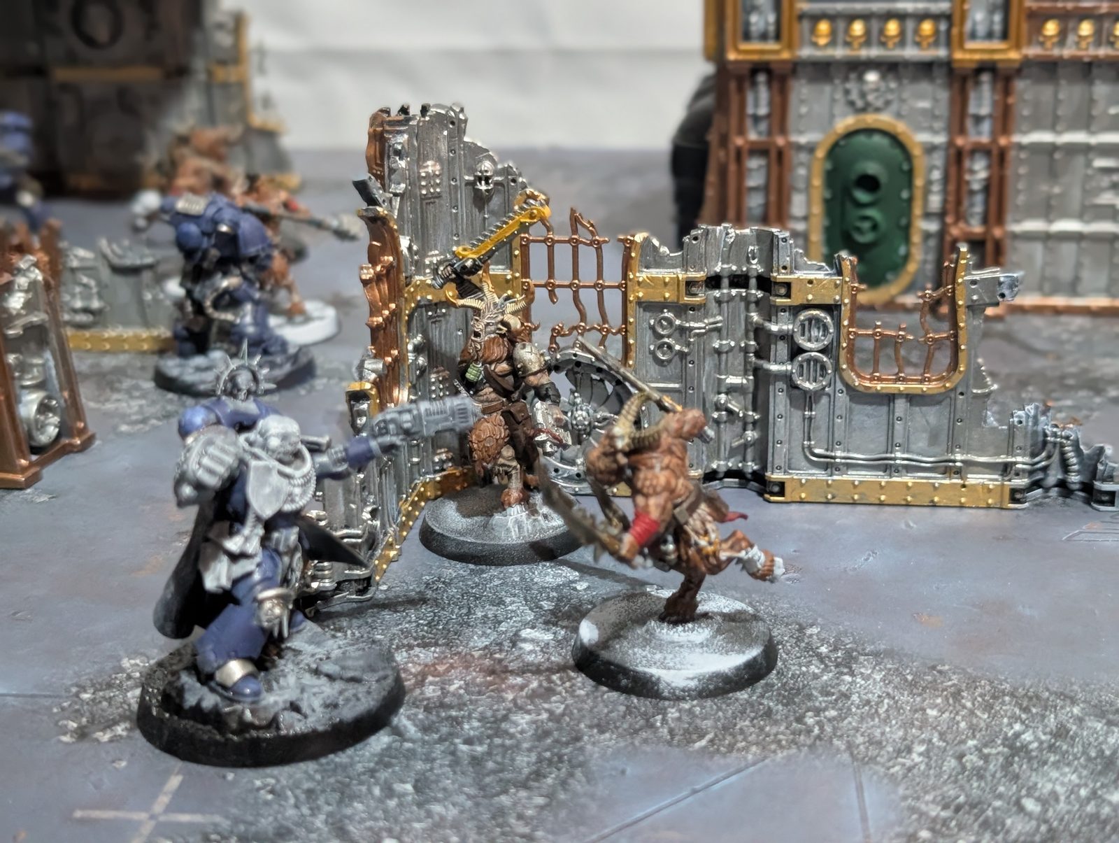 A Kill Team skirmish underway on painted terrain