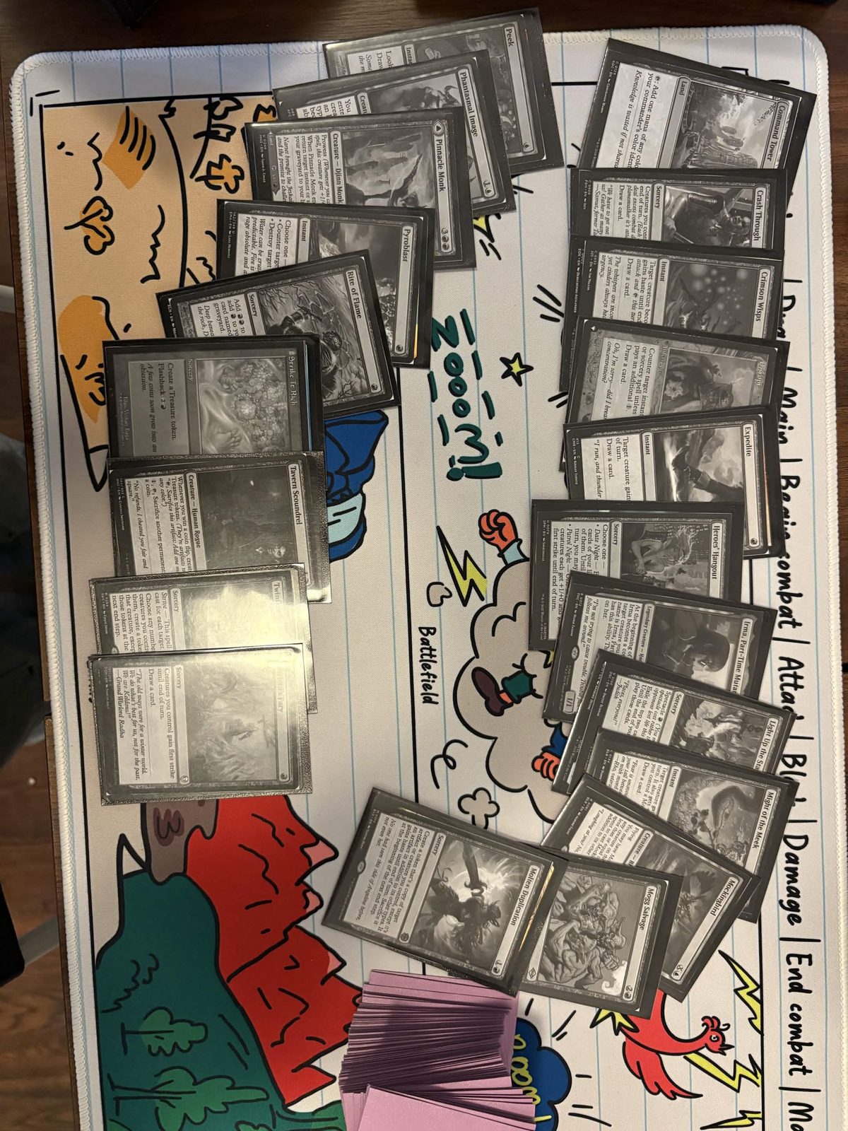 Magic: The Gathering cards laid out on a playmat